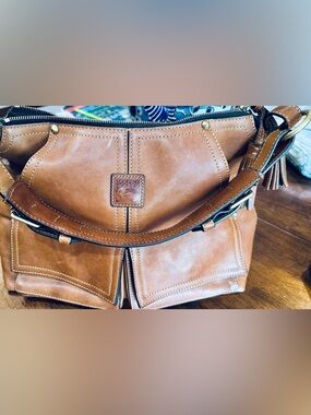 Dooney & Bourke Tan Leather Shoulder Bag with Front Pockets and Tassel